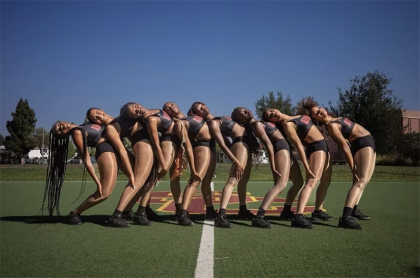 USC Cardinal Divas lined up on a field 