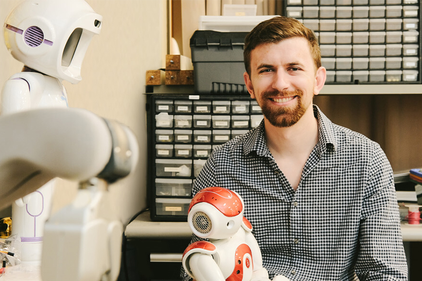 Photo of Chris Birmingham and robots