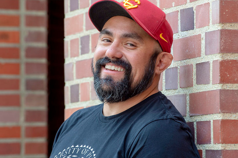 Orlando Ambriz in front of a brick wall