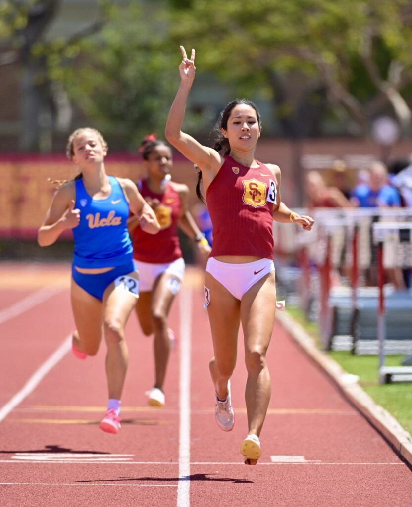 USC's Tracy Towns finishing a race with a UCLA runner and USC's Leah Disher in the background